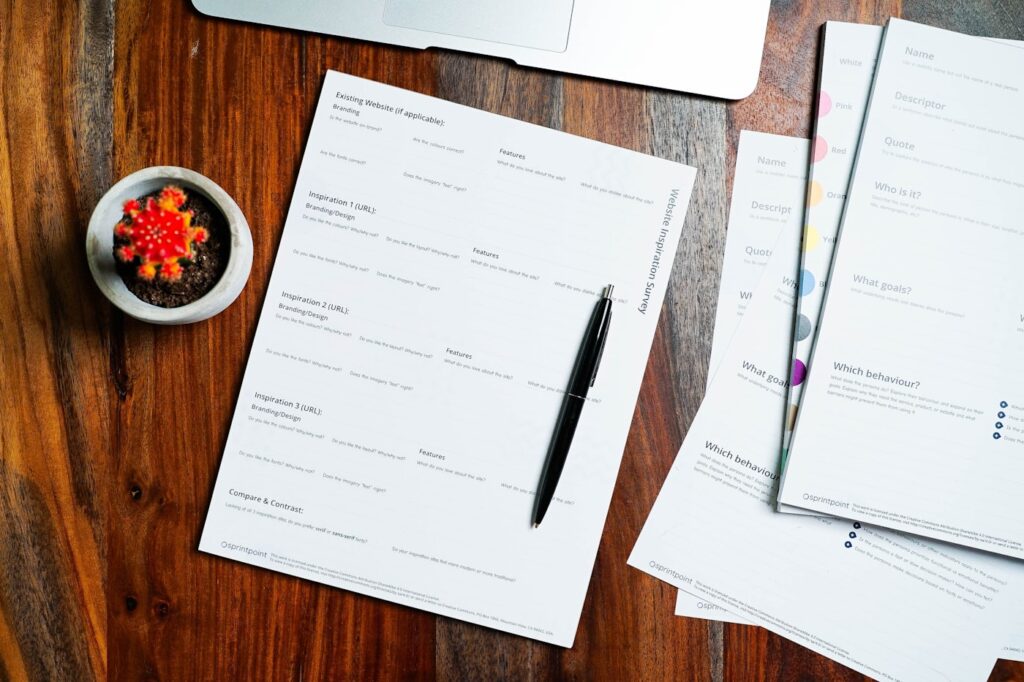 Registration paperwork and a pen on a desk